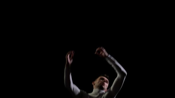 Jump gymnast men on a black background on a trampoline. Freedom and flight — Stock Video