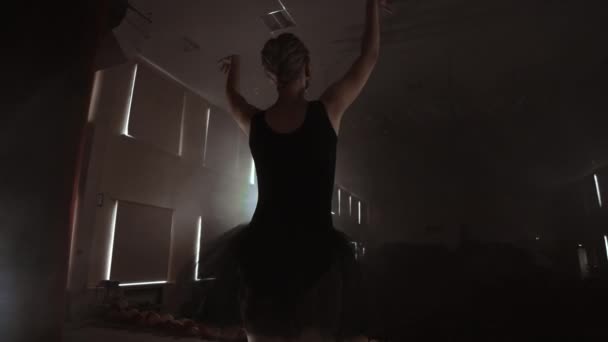 Slow motion: prima ballet on stage rehearsing performance in the dark light of the contra. The lights from the hall. — Stock Video