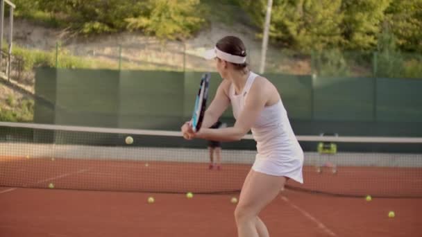 A tennis player prepares to serve a tennis ball during a match. — Stock Video