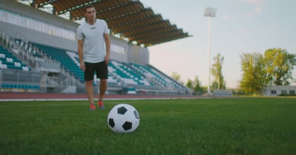 Soccer player performs outstanding play during a soccer game on a professional outdoor soccer stadium. Player wears unbranded uniform. Stadium and — Stock Video