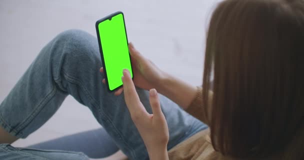 Phone with Green Screen and Chroma Key Closeup. Chromakey Mockup with Tracking Markers and Alpha Matte. POV is Vertical Template of Device in Modern House Closeup. Scroll Up Online News at Cellphone — Stock Video