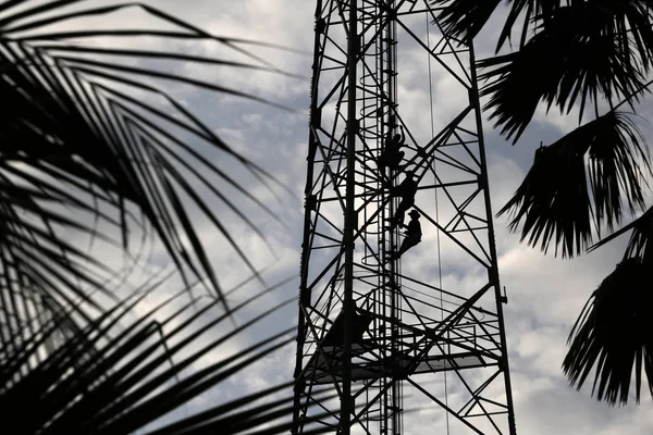 Workers Climbing Repair Telecommunication Tower Poles Evening Red Sky Sunset — Stock Photo, Image