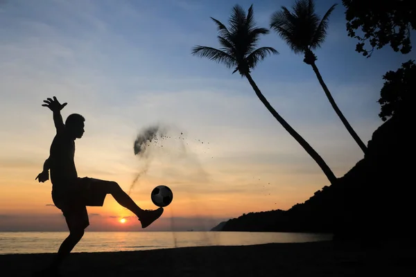 Silhouette Volley Kick football on the beach, Asian man play soc