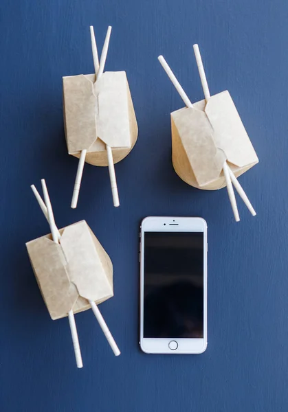 Brown wok container with telephone — Stock Photo, Image