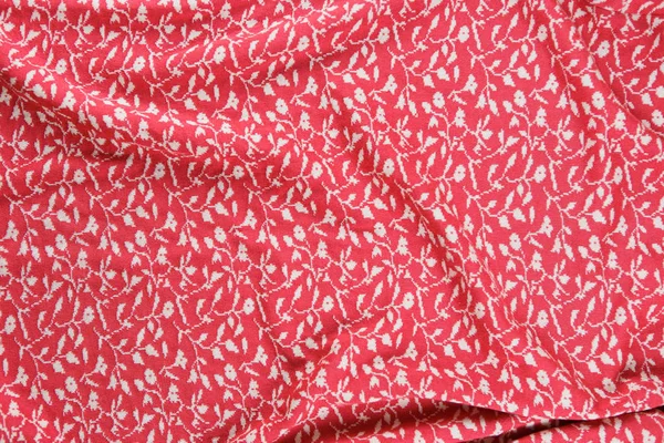 Хлопок трикотажные ткани в розовом цвете в качестве фона — стоковое фото