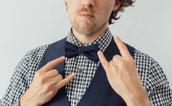 Man with beard in a bowtie with funny gesture — Stock Photo, Image