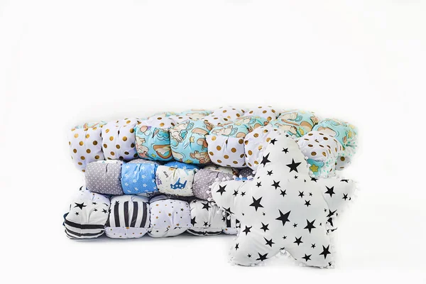 Patchwork comforter and five-pointed star shaped pillow on white background