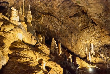 Moravian Karst, Czech Republic - May 05, 2013: A karst landscape and protected nature reserve in the eastern part of the Czech RepublicCave with many stalagmites and stalactites clipart