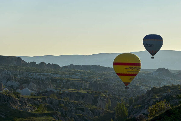 Cappadocia, Turkey - April 29, 2013Colorful hot air balloons flying over the valley at Cappadocia. Hot air balloons are traditional touristic attraction in Cappadocia.