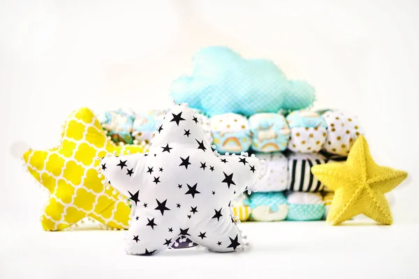 Pillows and patchwork comforter on white background