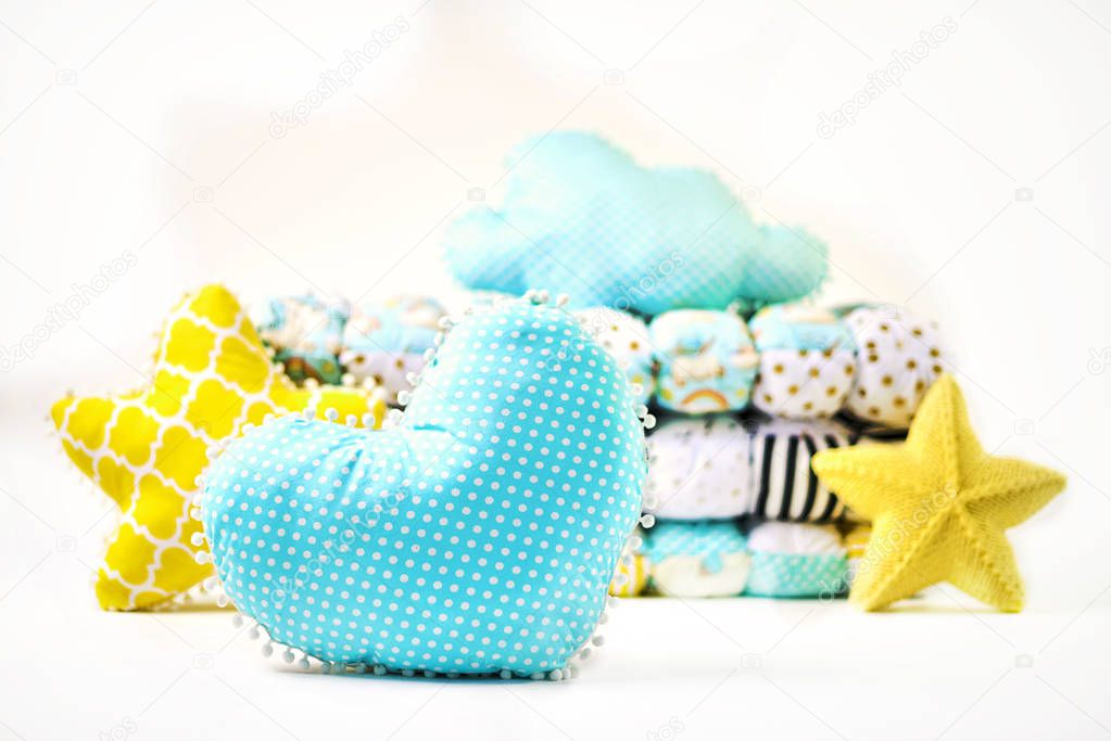 Pillows and patchwork comforter on white background