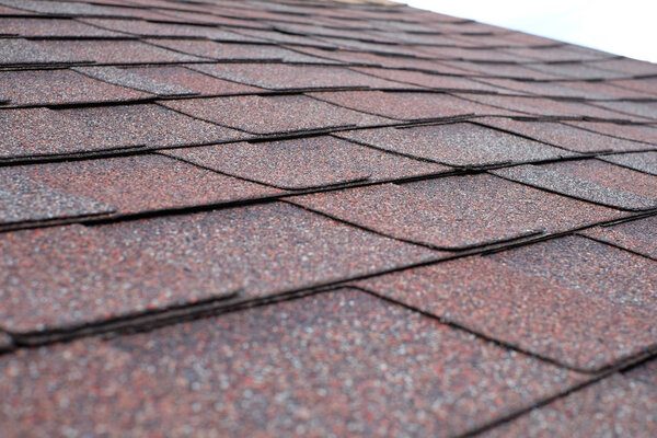Close up view on asphalt roofing shingles.