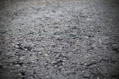 Bir koyu gri asfalt kaplama doku. Close-up yol tamiri.