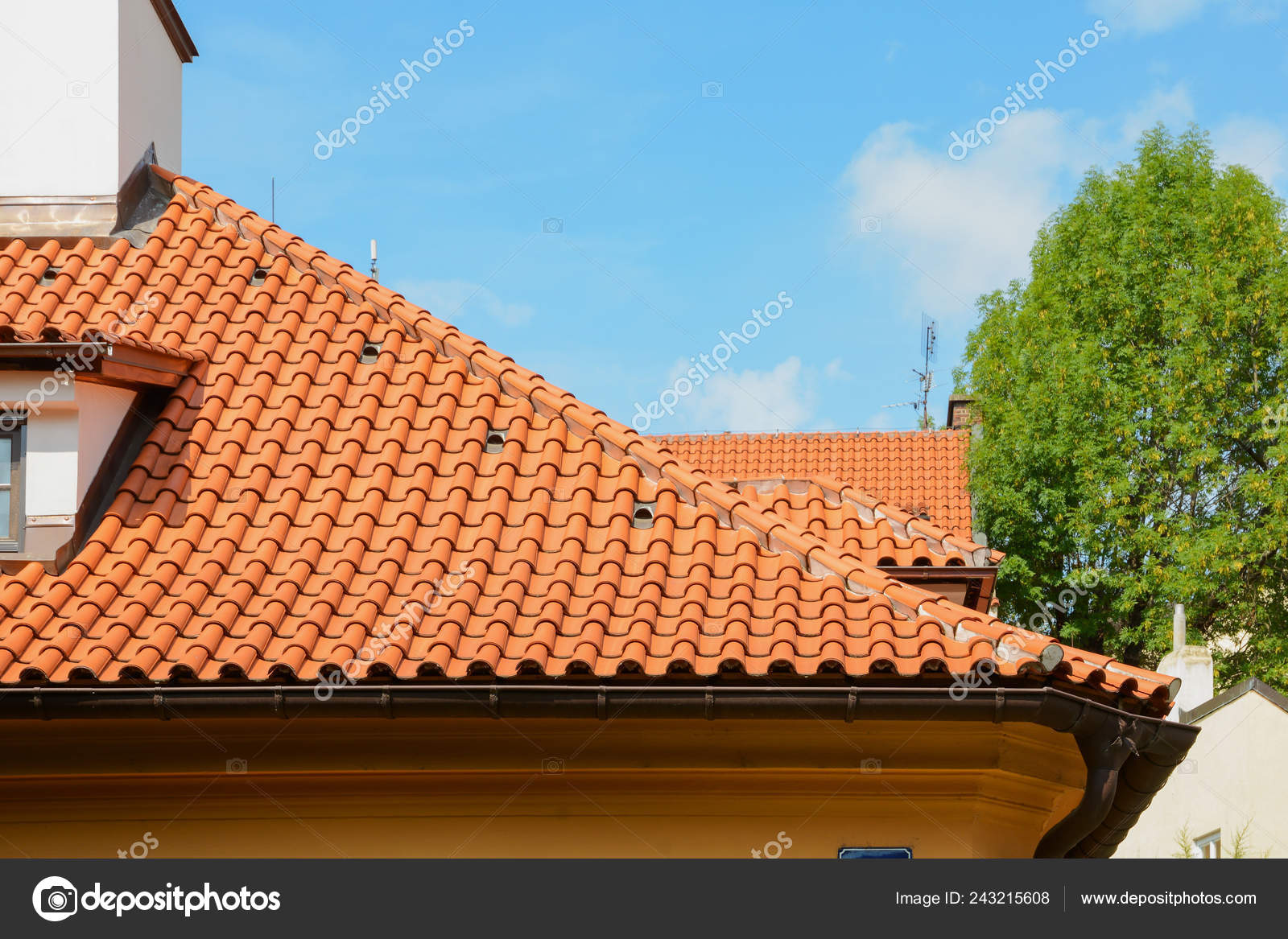 Red Ceramic Shingles Roof Attic Windows Chimney Blue Sky