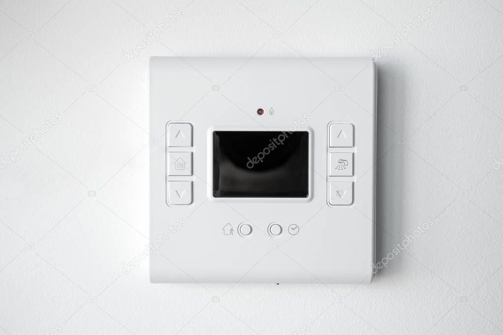 Modern programmable thermostat water heater (boiler) for setting the room temperature. Smart home.