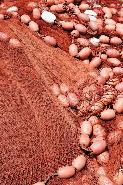 Fishing net with floats. Fishing nets drying on the dock