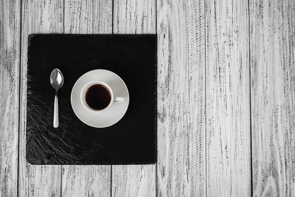 Чашка кофе и чайная ложка — стоковое фото