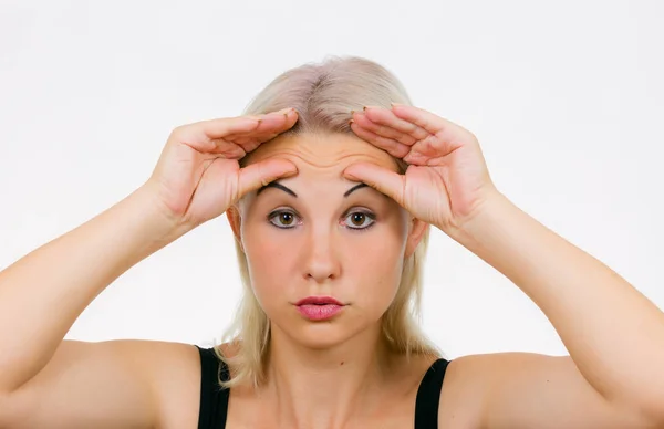 Face exercise brow raiser, woman lift her brows up with fingers