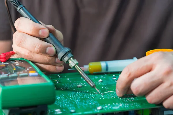 Repair and restore PCB of a uninterruptible power supply unit, soldering of electronic components