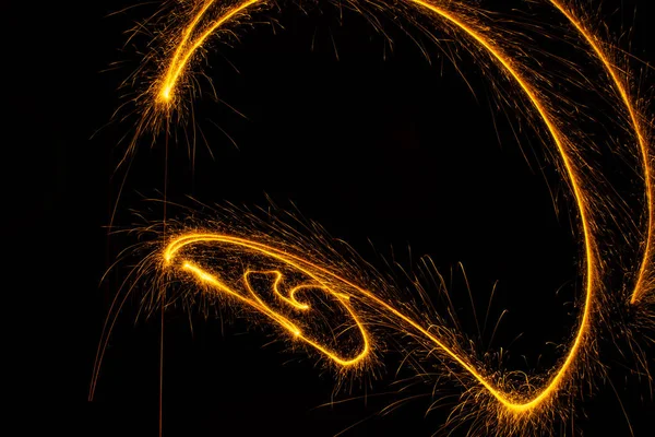 Abstract sparkler firework light on black background — Stock Photo, Image