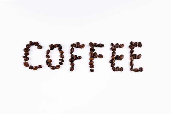 Coffee beans forming the word "Coffee" on a white background