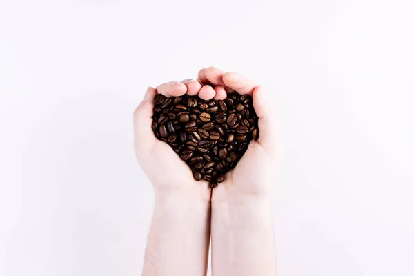 Dwie Ręczne Dziurkowanie Ziarna Kawy — Zdjęcie stockowe