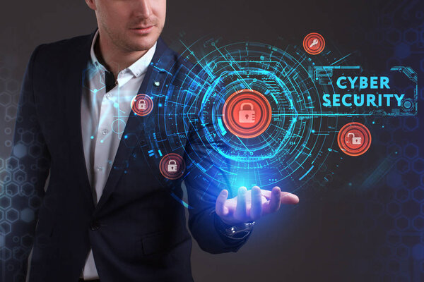 Business, Technology, Internet and network concept. Young businessman working on a virtual screen of the future and sees the inscription: Cyber security