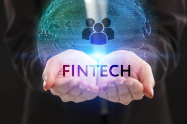 İş, teknoloji, Internet ve ağ kavramı. Geleceğin sanal bir ekranda çalışan genç bir girişimci ve yazıt görür: Fintech