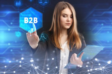 İş, teknoloji, Internet ve ağ kavramı. Geleceğin sanal bir ekranda çalışan genç bir girişimci ve yazıt görürse: B2b