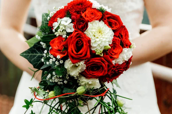 Handed wedding bouquet with roses and greenery — Stock Photo, Image