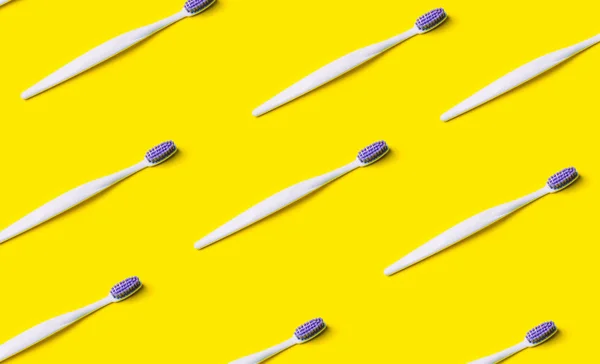 Toothbrush minimal pattern on yellow background.