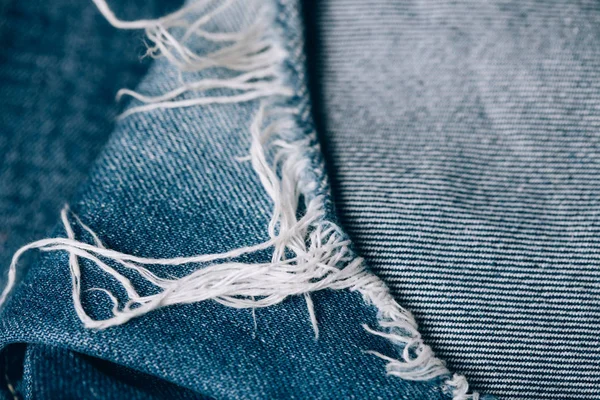 Macro texture of jeans hole and threads. — Stock Photo, Image
