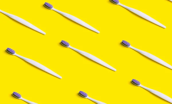 Toothbrush minimal pattern on yellow background.