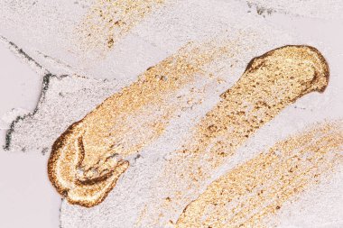 Altın boya dokusu. Makro görünüm.