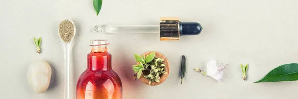 Minimal style. Natural cosmetics, handmade skin and body care. Orange bottle with peep and plants. Flat lay — Stock Photo, Image