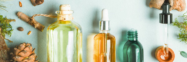 Homeopathic oils, dietary supplements for intestinal health Natural cosmetics, oils for skin care on a light background.