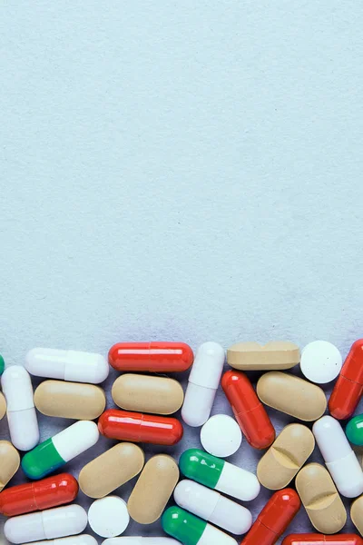 Pharmaceutical preparations, background. Colorful medications Pills, tablets and capsules are scattered. Medical concept