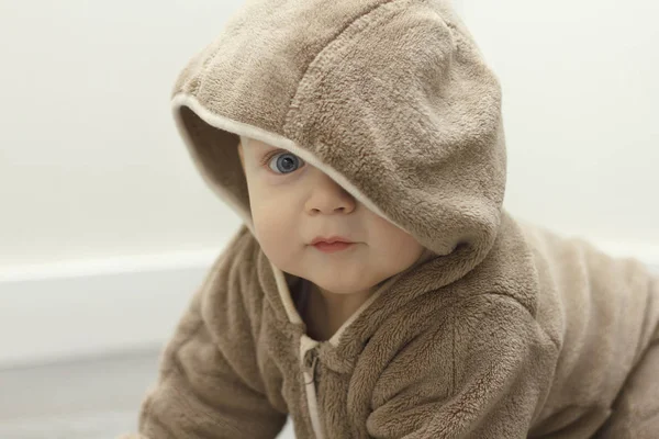 Cute baby boy in plush suit looking at camera — Stock Photo, Image