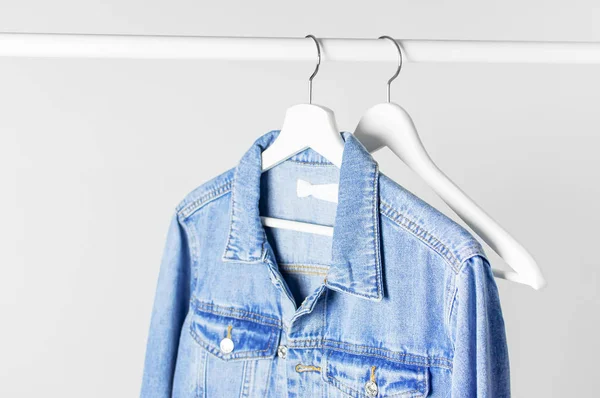 Blue Denim Jacket White Wooden Coat Hanger Rod Light Gray — Stock Photo, Image