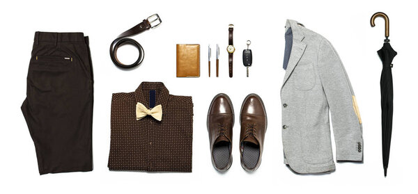 Flat lay set Men's classic clothing, jacket pants shirt bow tie leather belt shoes wrist watch wallet pens umbrella cane car keys isolated items on white background top view. Male fashion, business.