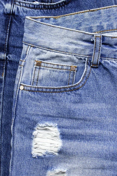 Satu set celana jeans biru yang berbeda. Detail jeans biru yang bagus. Tekstur Jeans atau latar belakang denim. Tekstur jeans denim biru, latar belakang kain grunge. Kecantikan dan fashion, konsep pakaian — Stok Foto