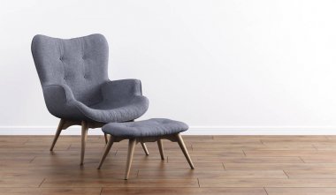 Ahşap ayaklı şık modern gri koltuk, iç beyaz bir duvara karşı Osmanlı. Mobilya, iç mekan, modern tasarımcı koltuğu. Şık minimalist iç mekan