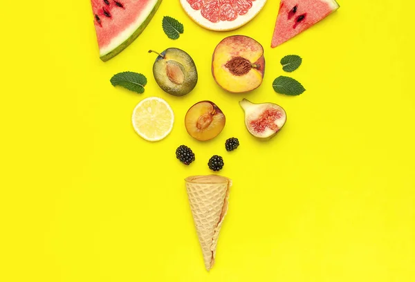 Tropical Summer Fruit Concept. Creative layout made of fresh ripe watermelon, peach, plum, fig, lemon, grapefruit, waffle ice cream cup, mint leaves on yellow background. Flat lay top view copy space — Stock Photo, Image