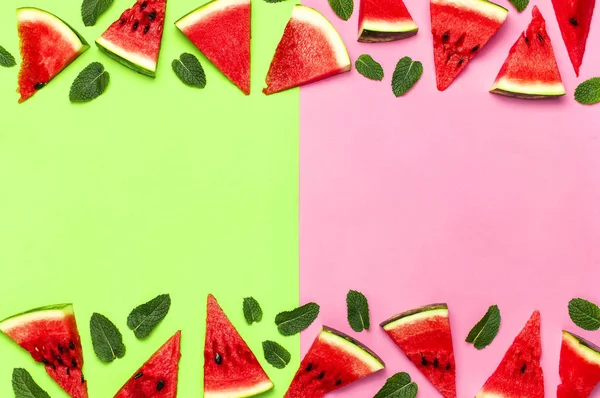 Watermelon pattern. Juicy slices of ripe red watermelon and mint leaves on multicolored pink and green background. Flat lay, top view, copy space. Creative summer food concept — Stock Photo, Image