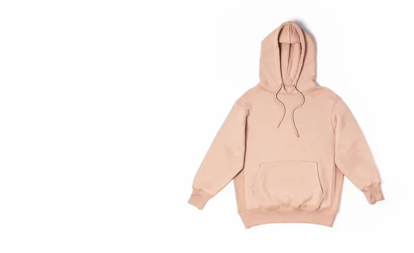 Dámská broskvově růžová mikina s kapsou a kapucí izolované na bílém pozadí. Fashionable dámské oblečení, hoody, ležérní styl mládeže, sporty. Podzimní móda — Stock fotografie