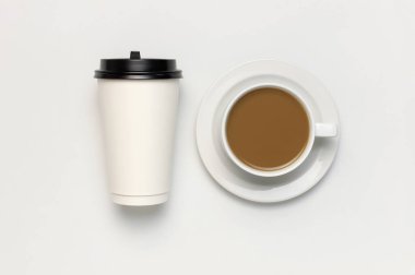 Coffee or tea paper cup, white cup with coffee on light gray background top view flat lay copy space. Take away coffee cup, mockup. Minimal composition, layout for design clipart