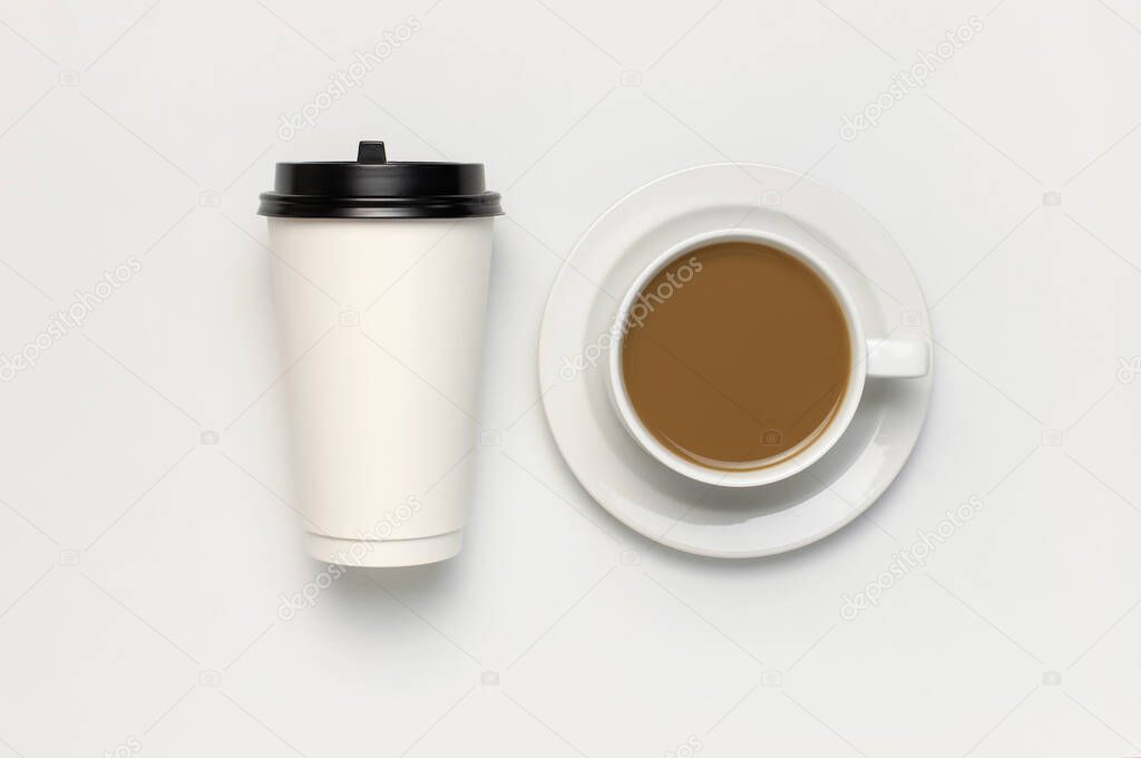 Coffee or tea paper cup, white cup with coffee on light gray background top view flat lay copy space. Take away coffee cup, mockup. Minimal composition, layout for design