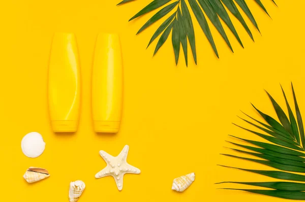 Yellow Bottles Sunscreen Cream Tropical Palm Leaves Shells Starfish Bright — Stock Photo, Image