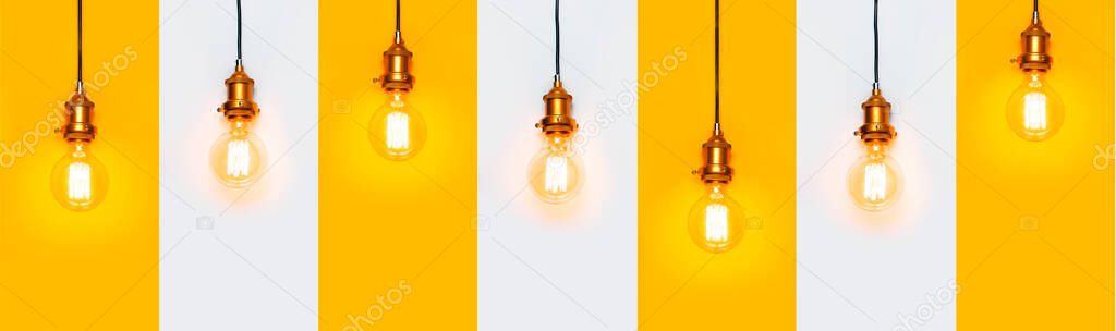 Creative idea concept, designer lamp, modern interior item. Vintage fashionable edison lamp on gray and yellow background. Top view flat lay. Lighting, electricity, pattern with lamp bulb.