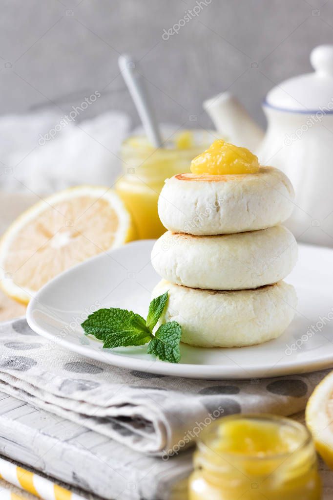 Cheese pancake on rice flour with lemon custard cream for breakfast on a light background
